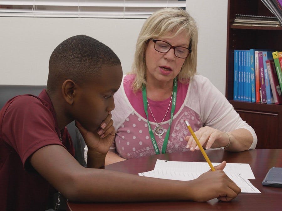 GYAC volunteer offering tutoring